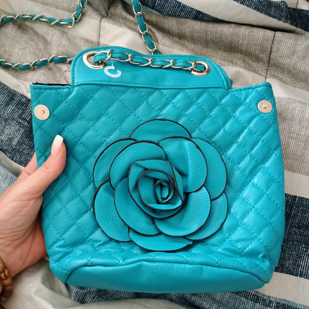 Chic Turquoise Quilted Bag with Floral Accent